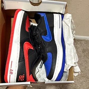 Nike Kids Low-Top Sneakers in Black with Red & Blue Swooshes